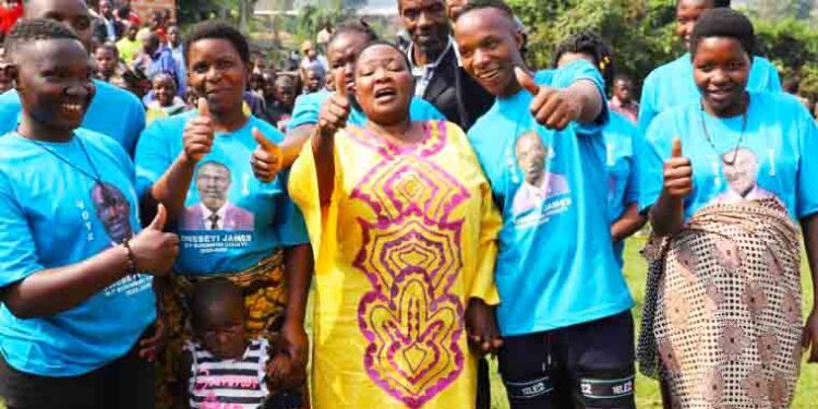 Prime Minister Robinah Nabbanja takes a picture with FDC supporters