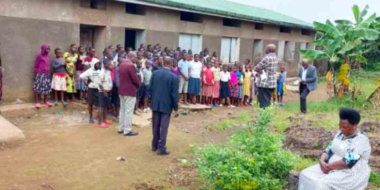 Kisoro RDC Hajji Shafiq Sekandi addresses pupils at Kampfizi Primary School