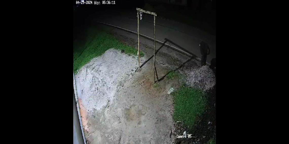 A screen grab from the CCTV footage captured at Harera Sam's house. A person is seen kicking a heap and then picking and dropping unknown things