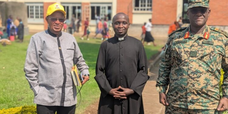 Col Deo Kayita, Ref Fr Deus Uwiringiyimana and Brig Gen. Kabango pose for a photo after addressing the youth. [PHOTO by Gerald Niyirinda]