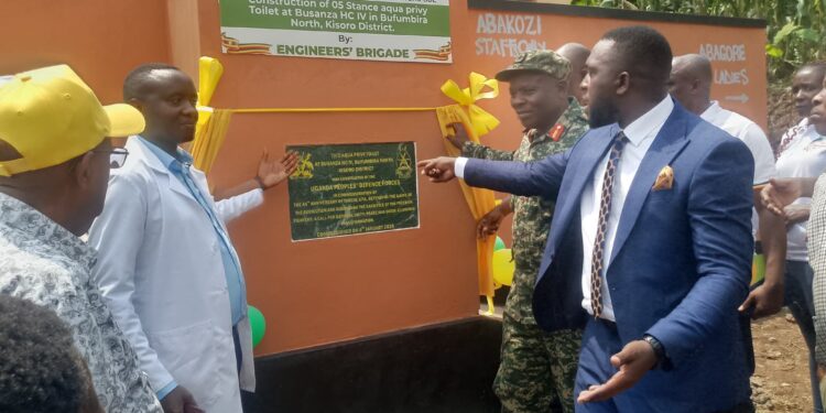 Officials commission a 5-stance aqua privy toilet at Busanza Health Centre IV on Tuesday.