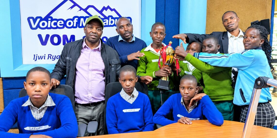 learners posing for a photo in voice of muhabura studios [PHOTO] Dickens Twinomujuni
